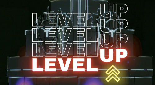 Screenshot of Level UP video. Logo for Level UP event overlaid on "UT Tower Projection Map" by AET '22 graduates