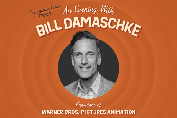 A promotional graphic with concentric orange rings features a black-and-white portrait of Bill Damaschke centered in a black circle. The text above reads “The Buckman Center Presents An Evening With BILL DAMASCHKE” and below reads “President of WARNER BROS. PICTURES ANIMATION.