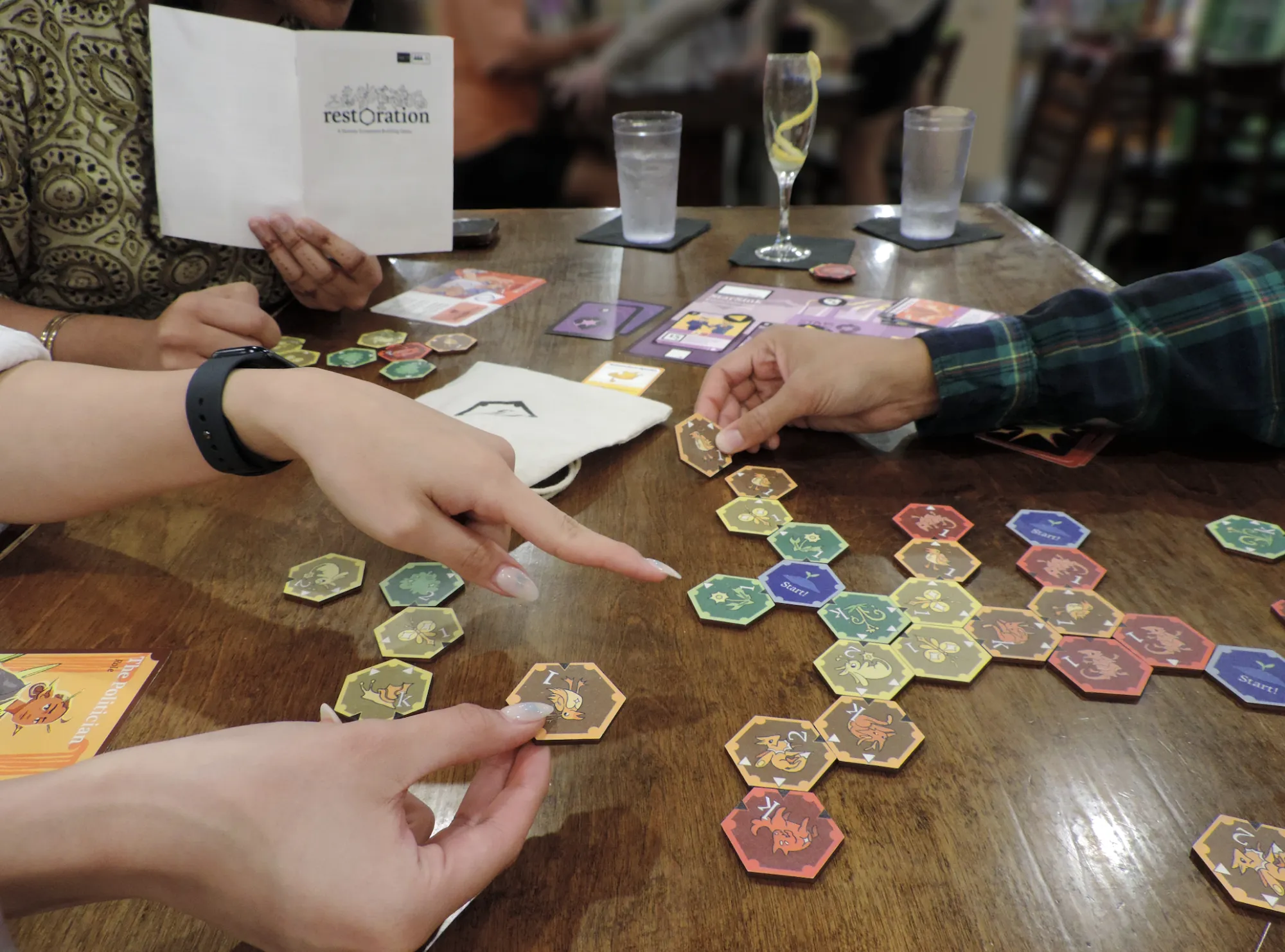 Image of board game created by Ceci Deleon-Wilson in use