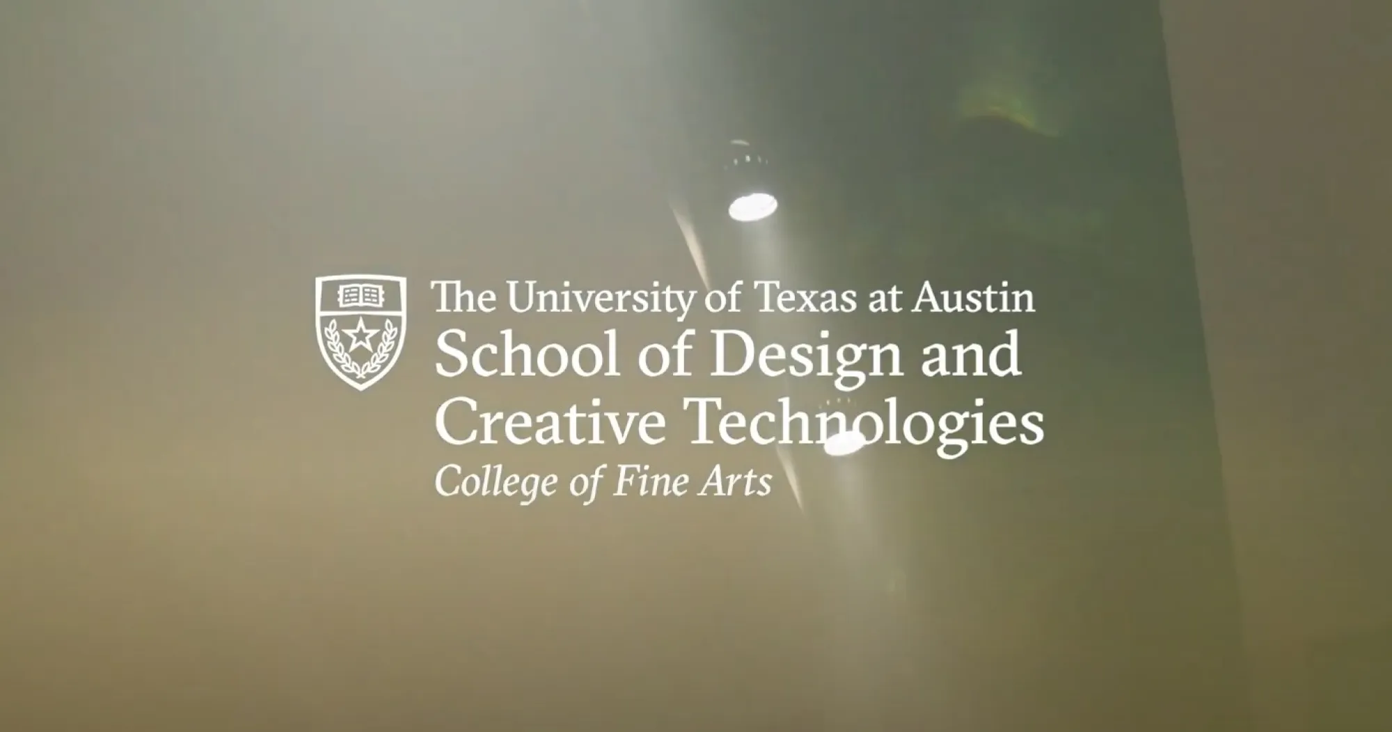 The School of Design and Creative Technologies logo against an ambient video background