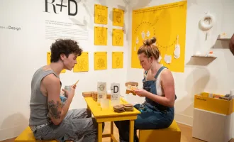 Photo of 2022 MFA Exhibition Over Under attendees interacting with R and D installation