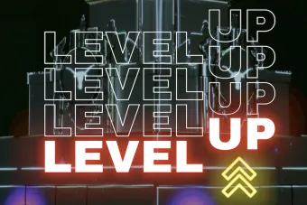 Screenshot of Level UP video. Logo for Level UP event overlaid on "UT Tower Projection Map" by AET '22 graduates