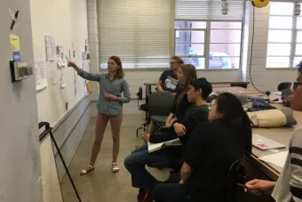 Caroline Rock (standing) presents during a class discussion in Jai Dandekar’s Spring 2017 Portfolio Critique course. Photo by Jai Dandekar.