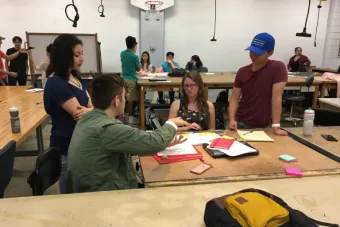 Students in DES 301 – Intro to Design Thinking work in groups to solve problems. Photo credit: Brooks Protzmann