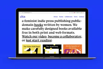 An open laptop against royal blue solid background displaying the Cita Press website homepage that features their mission statement.