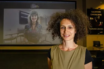 UT Austin professor Yuliya Lanina smiles in the foreground while NYU professor Carla Gannis smiles via Zoom on a screen in the background