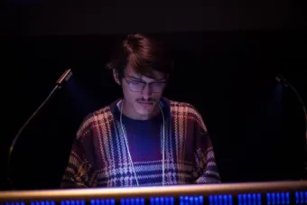 student running a light board
