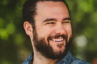 Smiling outdoor headshot of Lucas Artusi