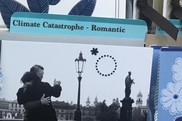 a black and white photo of a man and woman dancing on a bridge in a European city sits in a folder labeled "Climate Catastrophe - Romantic"