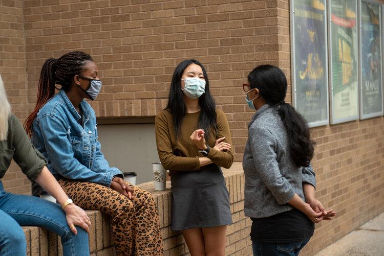 Design in Health student Amanda Wu talking with her classmates during an outdoor workshop