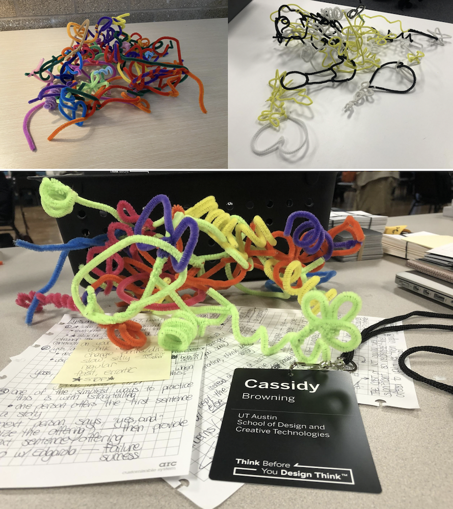 several piles of many colorful pipe cleaners, all connected together during a design thinking workshop facilitated by Cassidy C Browning