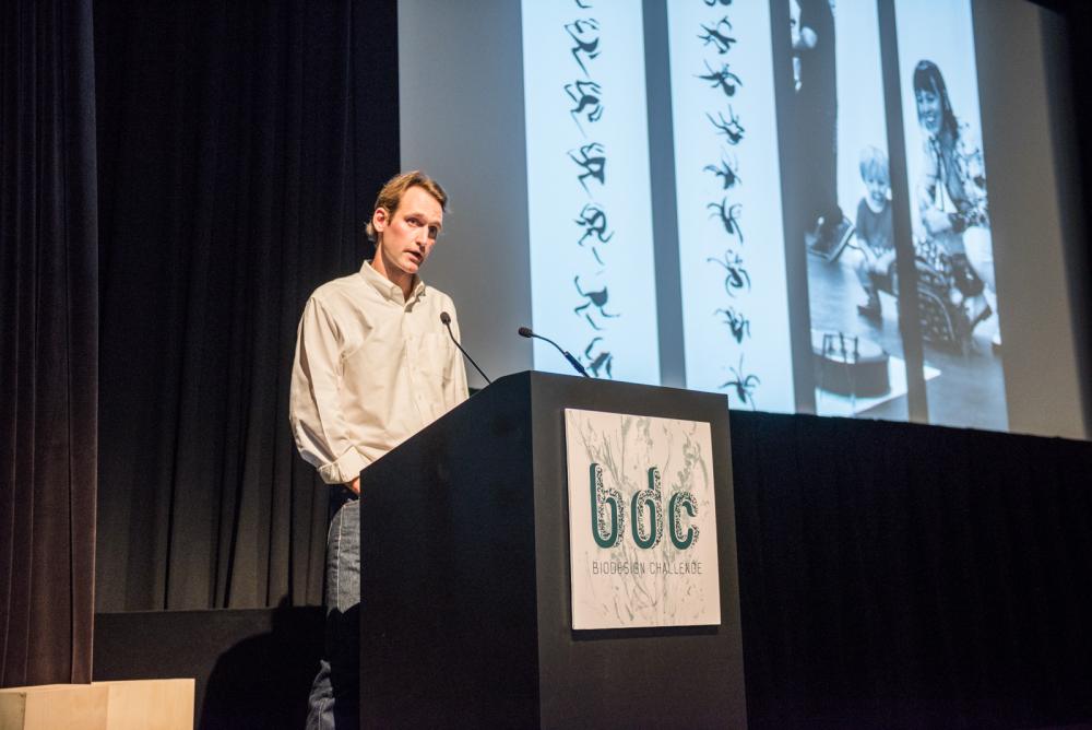 MFA student Brad Hakes presenting his project Orbweaver at Biodesign Challenge Summit 2023