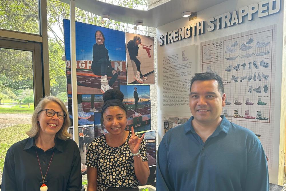 Alyssa Duhart in front of senior design project with Professors Kate Catterall and José Perez