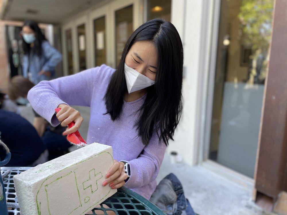 M.A. in Design focused on Health student Amanda Wu working on a project during an outdoor workshop