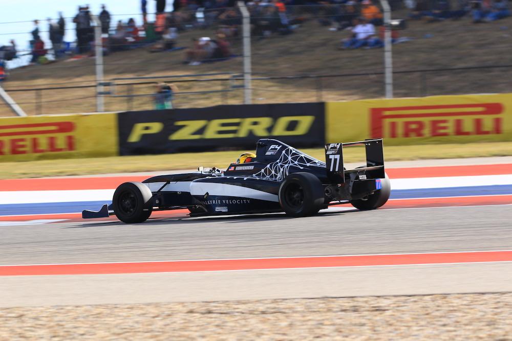Close up of race car driver Kory Enders driving the Valkyrie Velocity, designed by UT Austin student Hadley Chillura, in the 2019 Formula 4 Championship at Circuit of the Americas in Austin, Texas