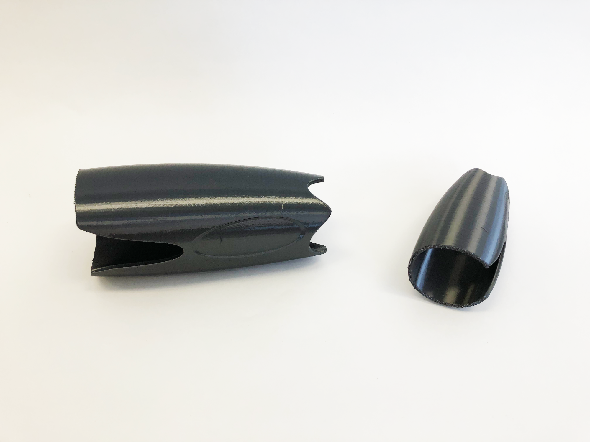 3D printed black prototype of MyKid-netic child surveillance device designed by Chloe Kim