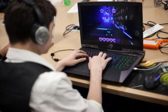 Student working on a game at a computer