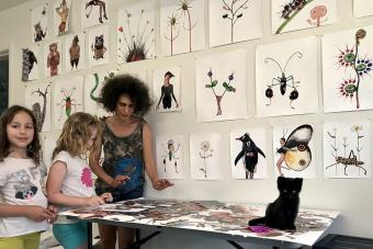 Arts and Entertainment Technologies faculty member Yuliya Lanina creating artwork with her two daughters at home while quarantining during COVID-19