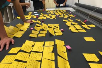 Post-it note exercise to help students work through problems. Photo by Jon Freach.