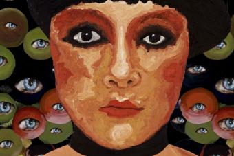 close up of Yuliya Lanina acrylic painting of a woman's face surrounded by floating eyes on red, green, and black circles.