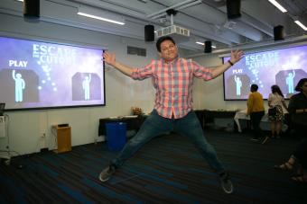 Student Alejandro Palacios jumps for joy over successful original game "Escape the Cutout"