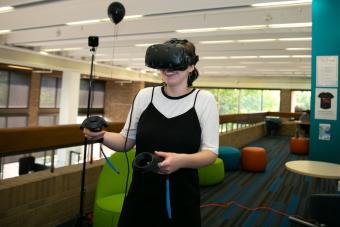 SDCT intern Michaela Newman tries virtual reality for the first time