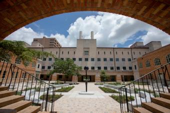 wide angle shot of the Anna Hiss Gymnasium courtyard on a sunny day in Austin. AHG houses the Department of Design at SDCT.