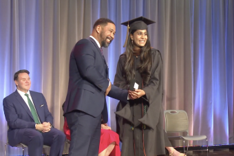 SDCT Industry Relations Manager Jamil Hooper presenting an award to Design in Health graduate Divya at 2022 Convocation