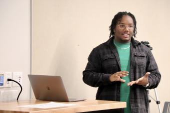 Design student Khalil J. Davis presenting his work during the Fall 2022 Sophomore Review in the Department of Design at UT Austin