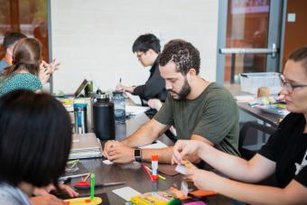 Medical student working on a prototype in the Master of Arts in Design focused on Health program at UT Austin