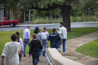 Undergraduate Admissions Coordinator David Rezaei leading a prospective students and parent tour on UT Austin campus
