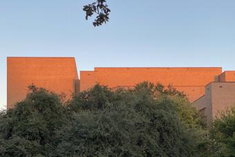 wide shot photo of UT Fine Arts building at dusk