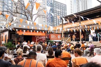 Photo of stage decked out in burnt orange and white at Discover Texas South by Southwest event 