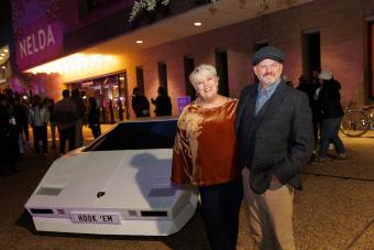 Karl and Nelda Buckman smiling in front of the Lamborghini Countach replica created by SDCT students