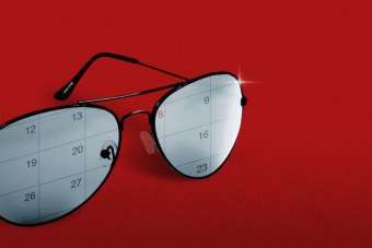 Sunglasses reflecting a calendar