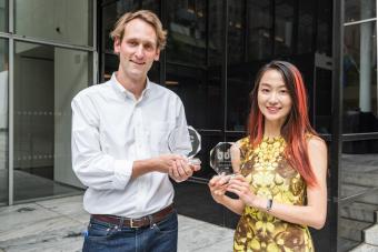 Professor Jiabao Li and MFA in Design student Brad Hakes receiving their awards at the 2023 Biodesign Challenge Summit at MoMA