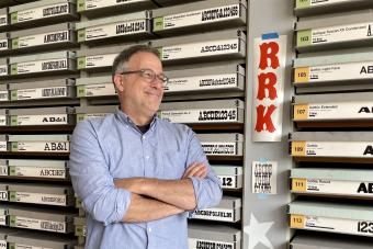 David Sheilds posing in front of the Rob Roy Kelly American Wood Type Collection during his visit in Fall 2023
