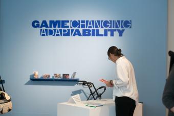 A Becauseisms attendee interacting with Game Changing Adaptability installation