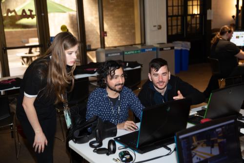 VR team working together on laptop at VR Austin Jam