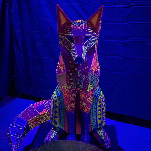Alebrije sculpture fox with UV lights and glow in the dark paint for Into the Mind of Pedro Linares immersive installation