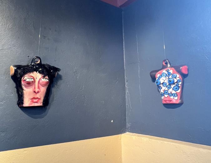 Photo of Gaze art exhibit by Yuliya Lanina featuring two mannequins whose breasts resemble eyes watching the viewer 