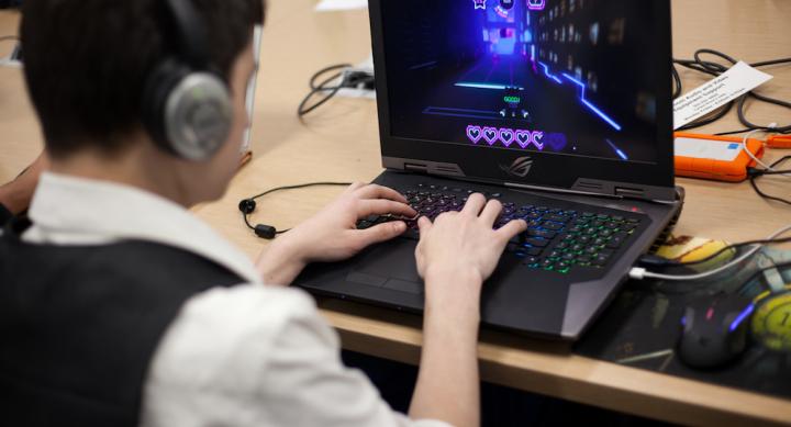 Student working on a game at a computer