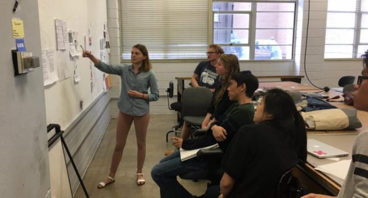 Caroline Rock (standing) presents during a class discussion in Jai Dandekar’s Spring 2017 Portfolio Critique course. Photo by Jai Dandekar.