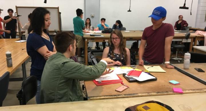 Students in DES 301 – Intro to Design Thinking work in groups to solve problems. Photo credit: Brooks Protzmann