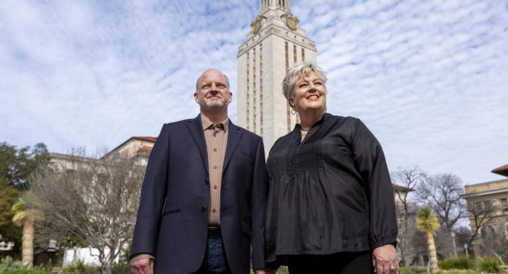 Central Texas philanthropists Karl and Nelda Buckman posing in front of the UT Austin Tower
