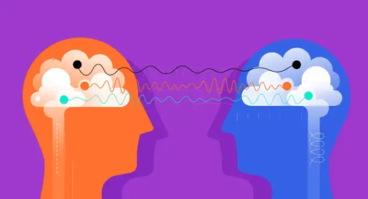 Illustration of two heads facing each other with their brains connected by wires